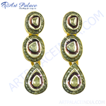 Load image into Gallery viewer, gold plating teardrop earrings with a brown and white colored center stones with smaller diamond accents, a luxurious earring design
