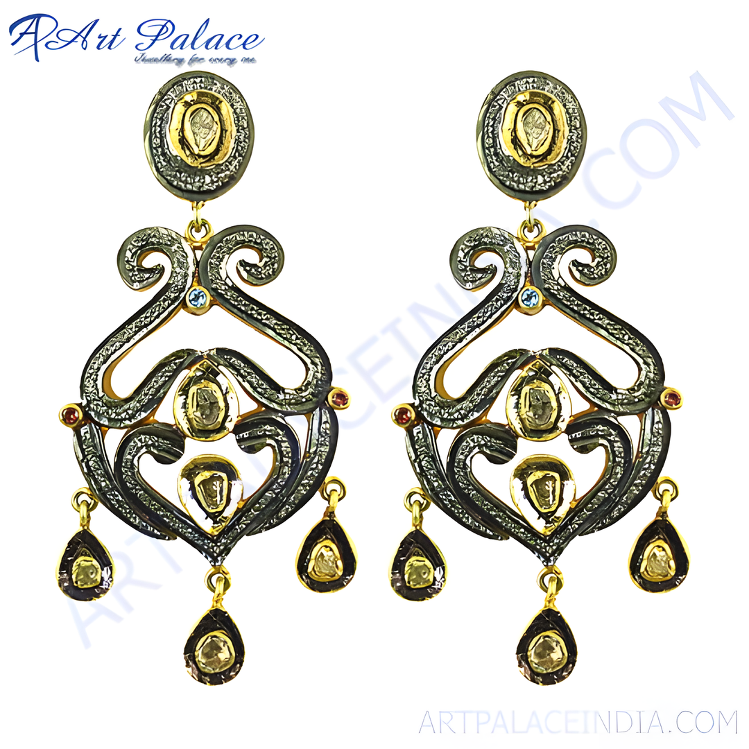 gold plating and black diamond dangle earrings with intricate design and teardrop accents.