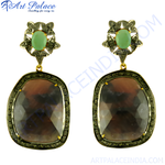 Load image into Gallery viewer, Dangle earrings featuring a large brown gemstone and a green gemstone accent, set in a detailed metal frame.
