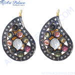 Load image into Gallery viewer, Multi-gemstone teardrop earrings with a silver frame, featuring various colorful gemstones and a gold plating hook.
