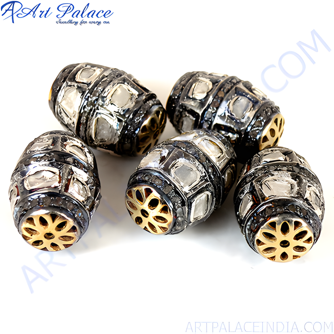 Close-up of diamond-cut beads in silver and gold, perfect for jewelry making, with intricate details.