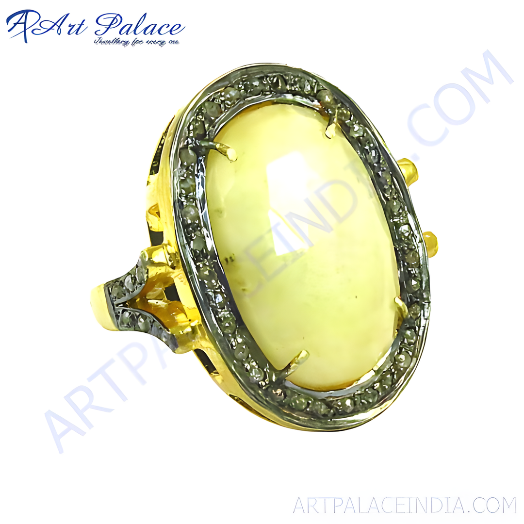 Gold ring with a large oval-shaped yellow gemstone, surrounded by smaller stones.