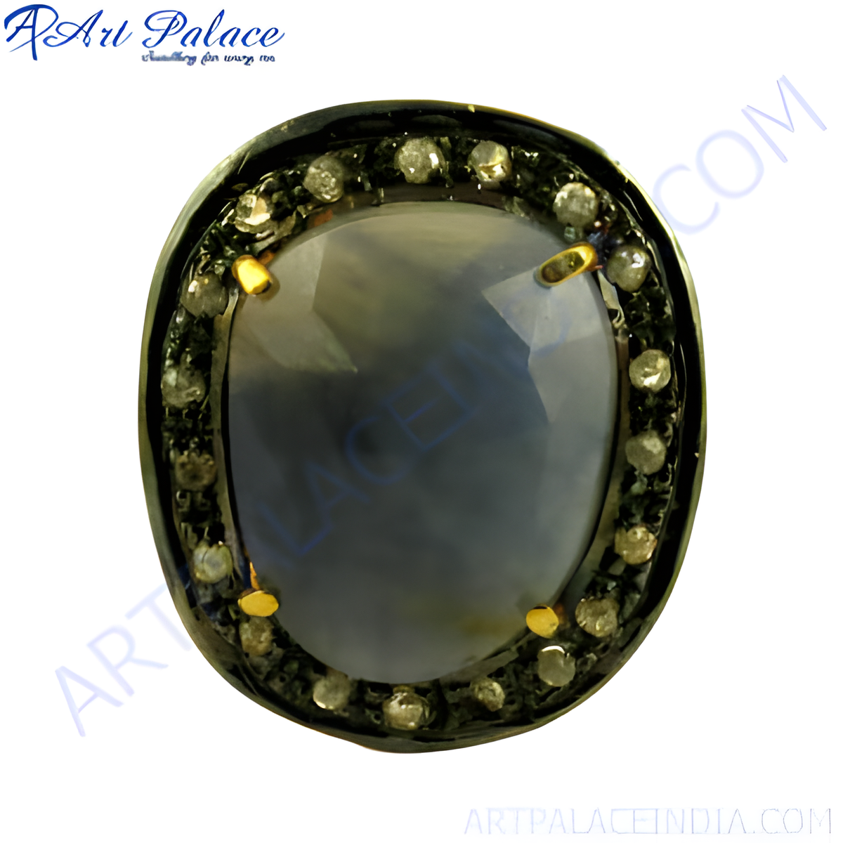 Oxidized silver ring with a large blue sapphire center stone and diamond halo