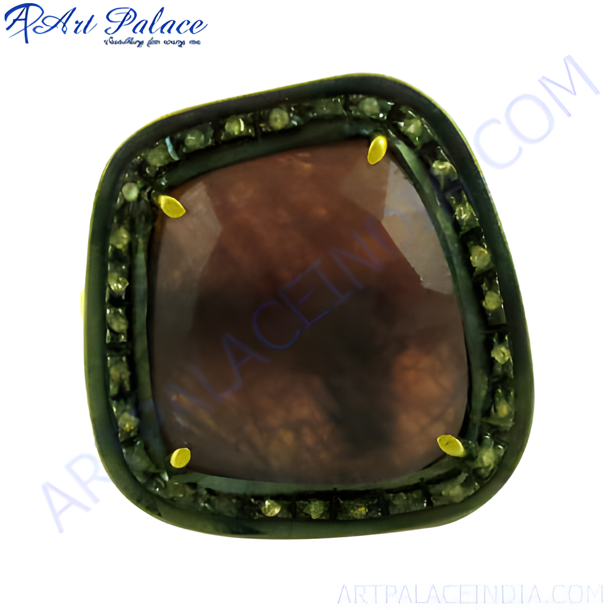 A close up of a ruby gemstone ring with a dark red center stone and a halo of smaller gemstones on a white background