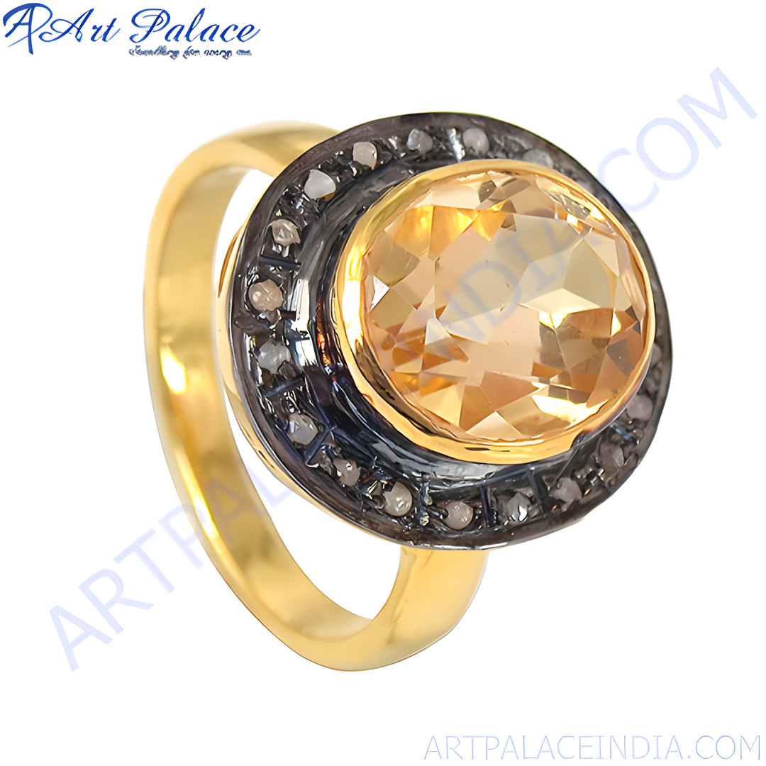 Gold ring with a large yellow citrine gemstone and small surrounding diamonds.