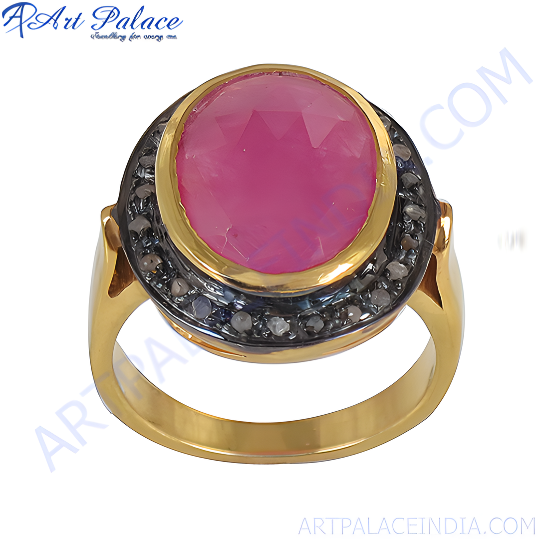 gold plating ring featuring a large oval ruby center stone surrounded by black diamonds