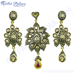 Load image into Gallery viewer, Gold diamond earrings and pendant set with intricate design and ruby accent.
