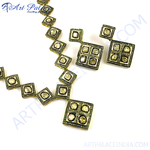 Load image into Gallery viewer, Gold necklace and earring set with diamonds, square design, and white background.
