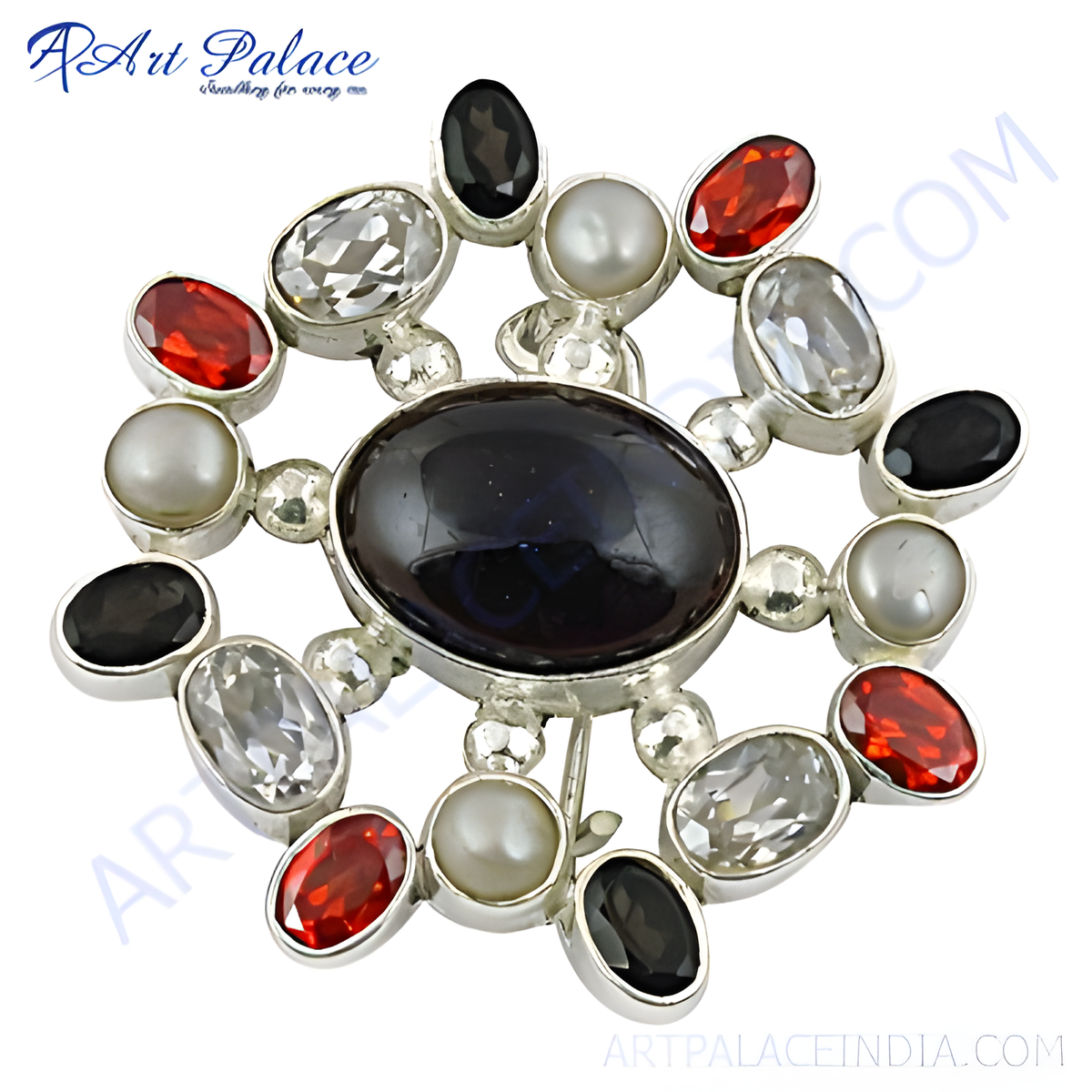 Sterling silver brooch with oval black gemstone center and surrounding red, white and black stones, and pearls