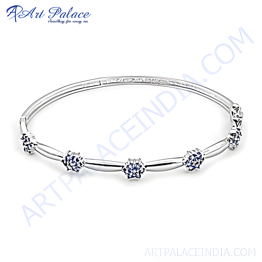 Sterling silver bracelet featuring multiple blue gemstones set in a minimalist design