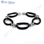 Load image into Gallery viewer, Silver and black oval link bracelet with polished black links and silver connectors.
