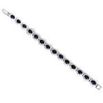 Load image into Gallery viewer, Silver sapphire bracelet with oval-cut blue gemstones on a white background
