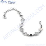 Load image into Gallery viewer, Silver chain bracelet with round cubic zirconia and geometric details.
