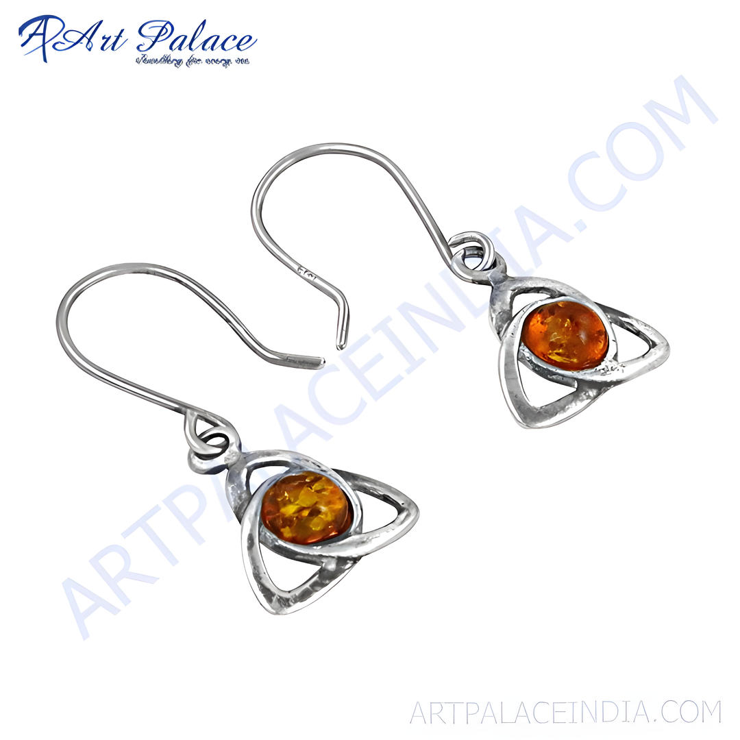 Sterling silver dangle earrings with amber gemstone in Celtic knot design.