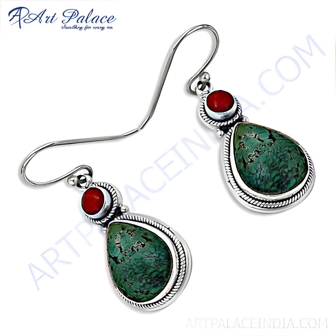 925 sterling silver dangle earrings featuring turquoise teardrop stones and coral accents.