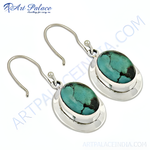 Load image into Gallery viewer, Sterling silver drop earrings with oval turquoise gemstones and hook closures
