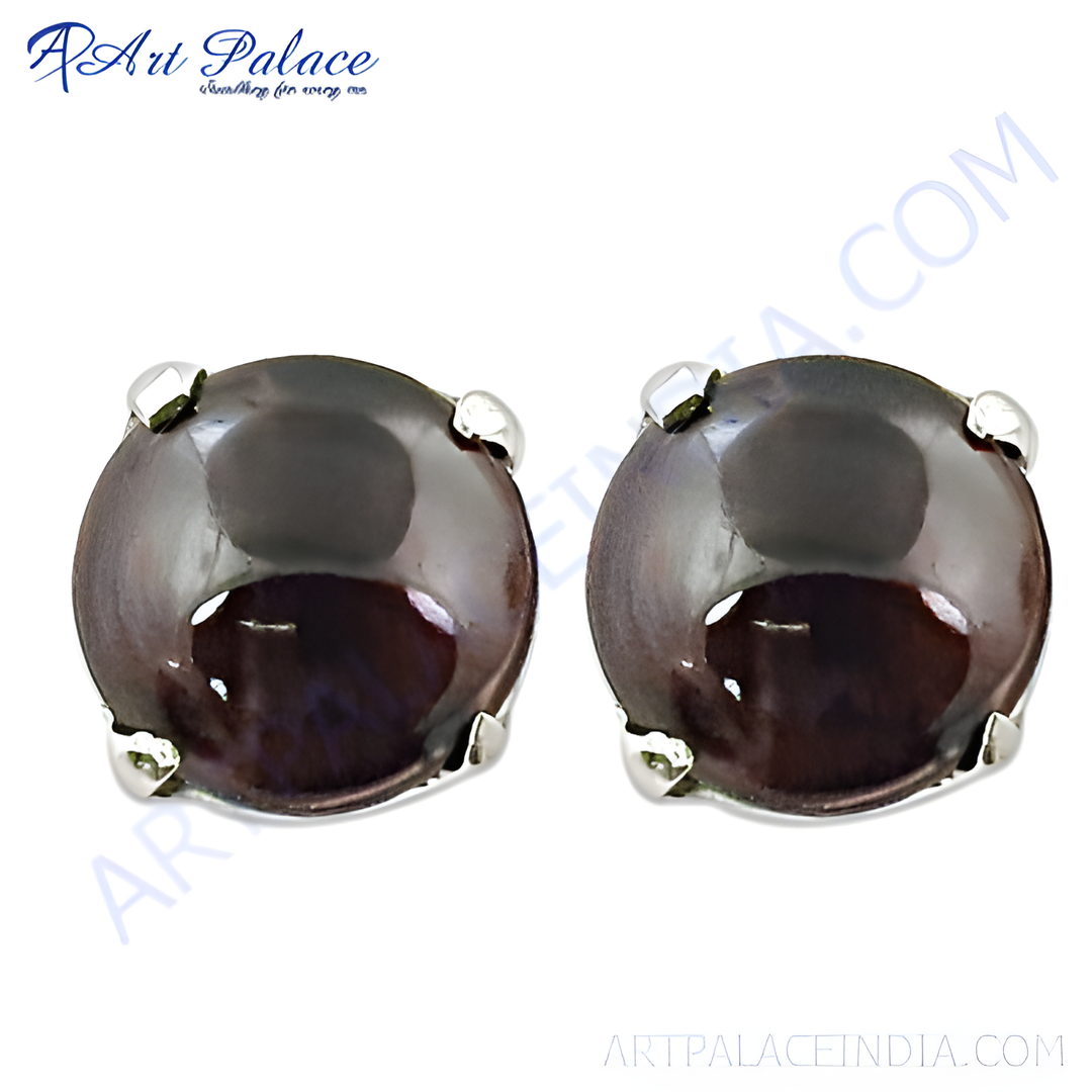 Round silver stud earrings with dark gemstone. Elegant and timeless design.