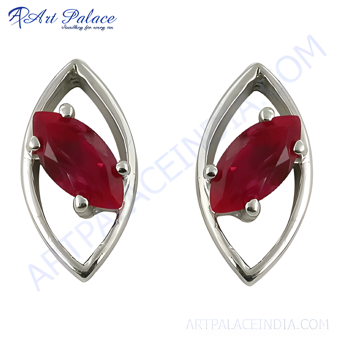 Sterling silver stud earrings with marquise-cut red ruby gemstones.