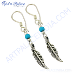 Load image into Gallery viewer, 925 sterling silver dangle earrings featuring turquoise beads and feather design.
