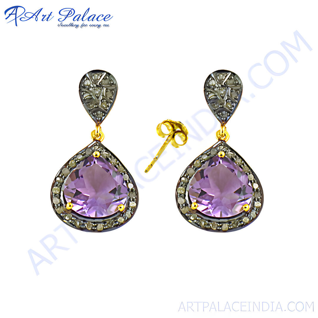 Silver drop earrings featuring a pear-shaped purple amethyst gemstone with diamond accents.