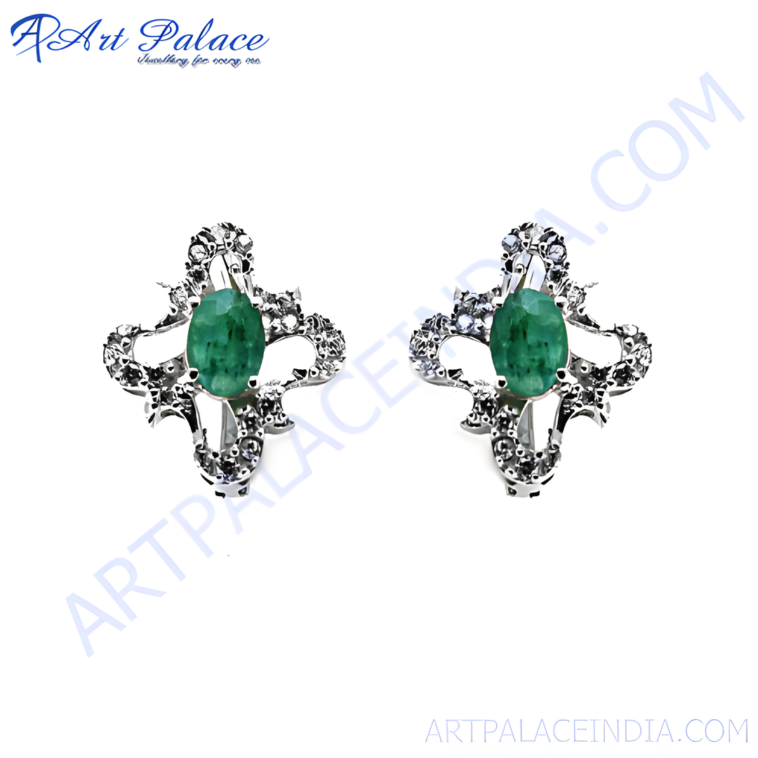 Silver stud earrings featuring oval emerald gemstones in a floral design. Green gemstone earrings for women.