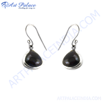 Load image into Gallery viewer, Sterling silver dangle earrings with black teardrop pearls and hook closure.
