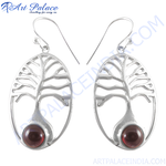 将图像加载到图库查看器中， 925 sterling silver dangle earrings featuring a tree of life design with a round garnet gemstone center.
