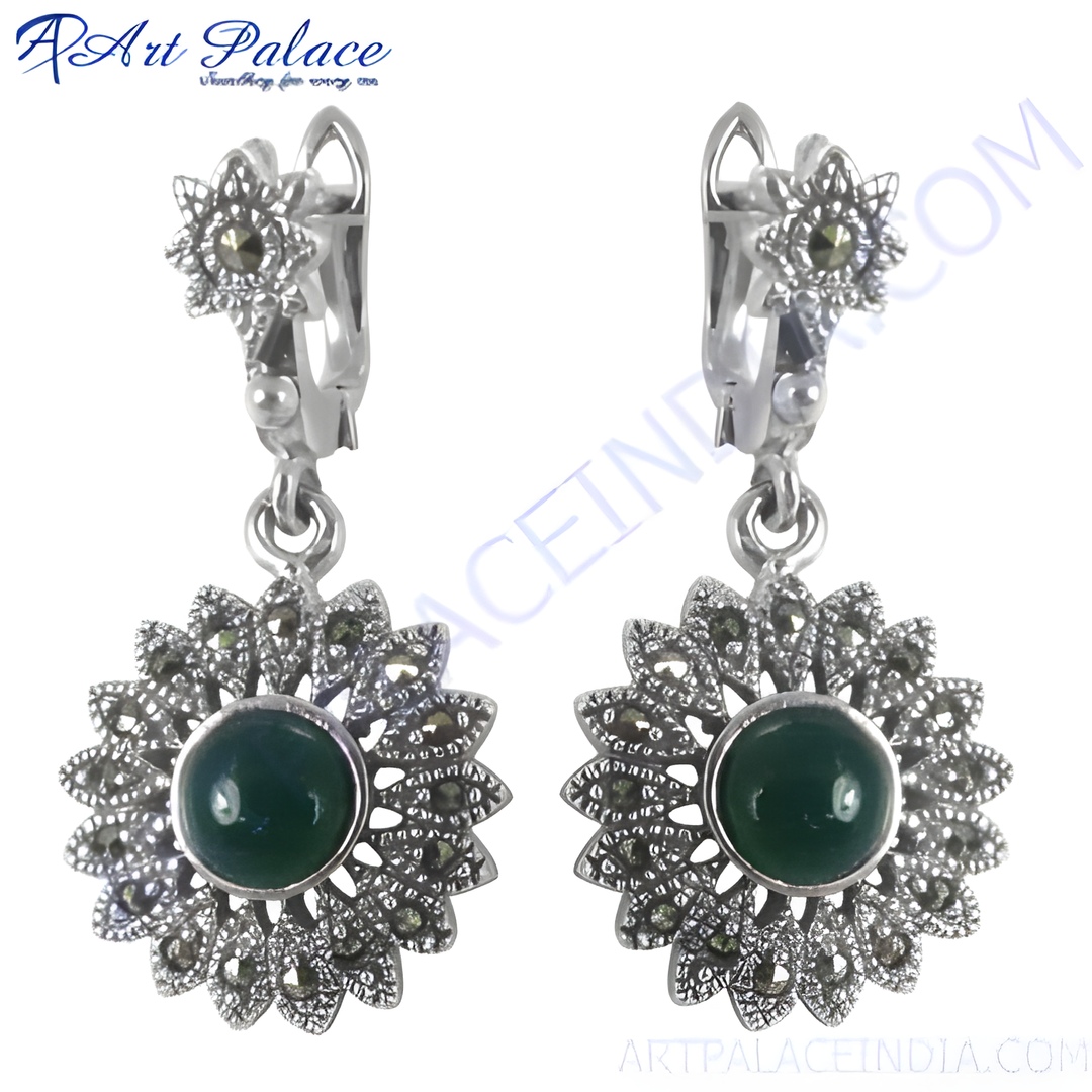 Sterling silver dangle earrings with a green gemstone center and marcasite accents. Floral design.