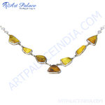 Load image into Gallery viewer, Silver necklace with natural amber gemstones, featuring yellow and brown colors in a unique pendant design.
