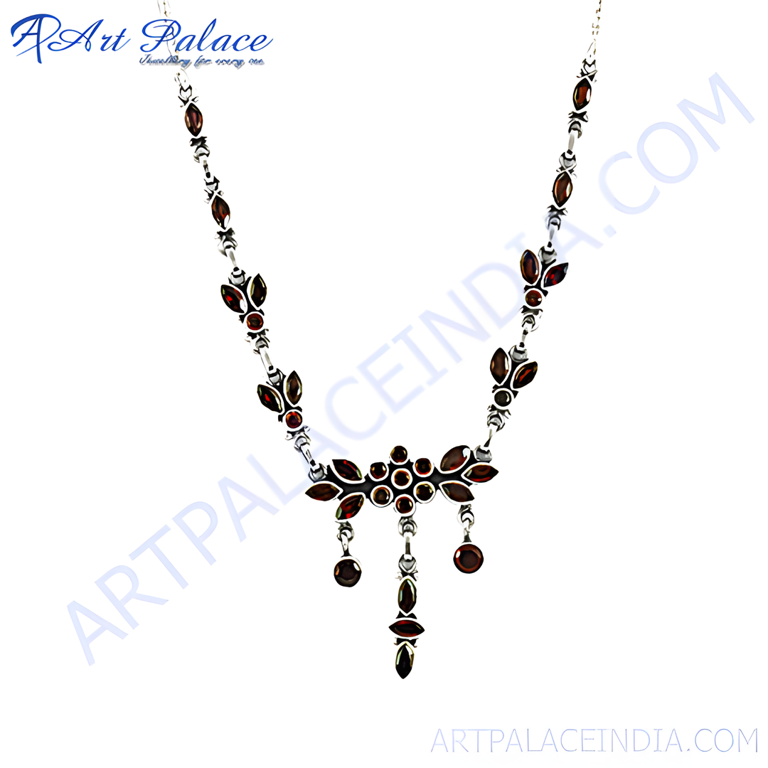 Sterling silver necklace with multiple red garnet stones in a floral pattern design.