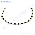Load image into Gallery viewer, Sterling silver necklace featuring alternating black onyx gemstones and clear cubic zirconia stones.

