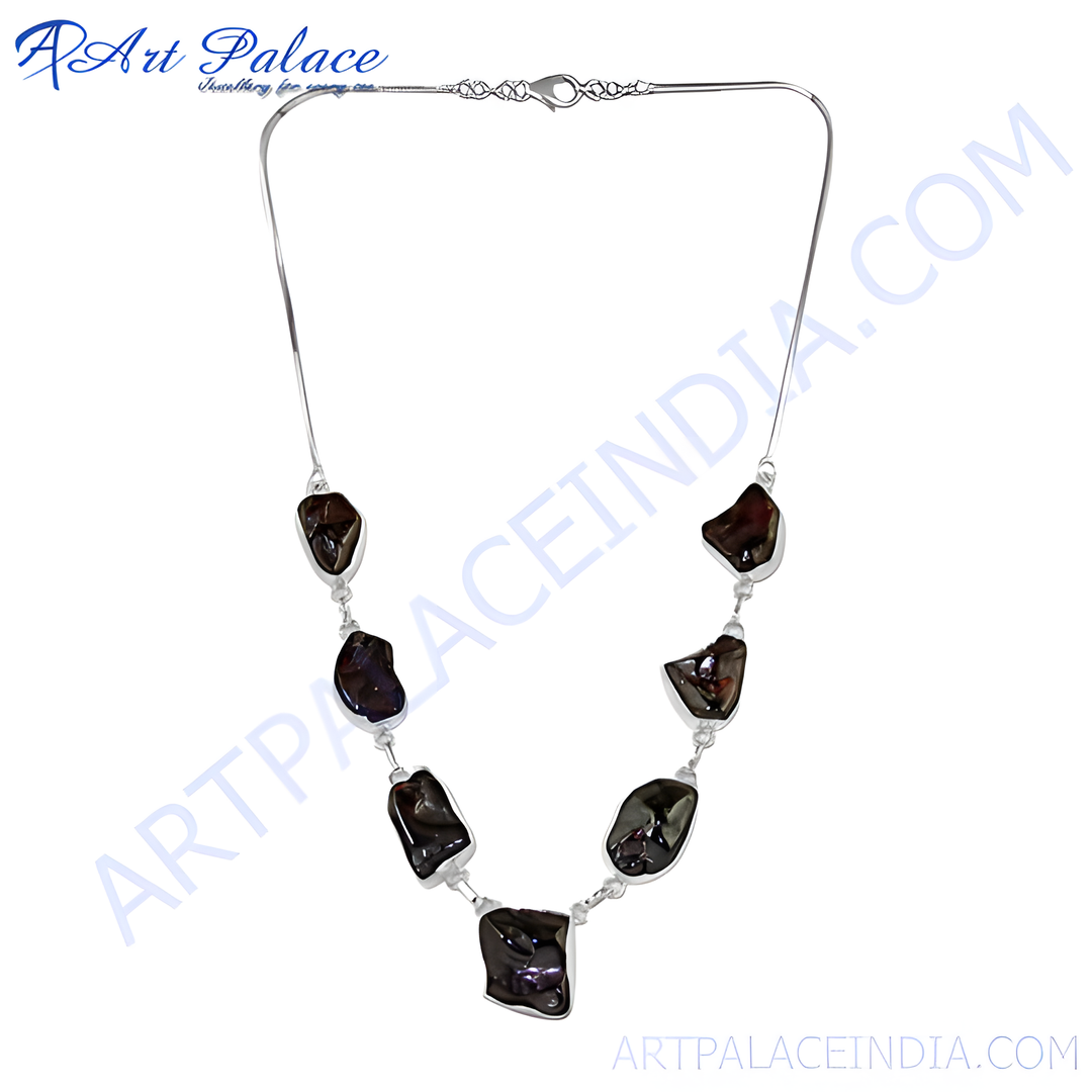 Silver necklace with dark, irregular black pearls. Elegant gemstone pendant necklace for women.