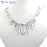 Load image into Gallery viewer, Sterling silver statement necklace displayed on a mannequin, showcasing the modern, flowing design.
