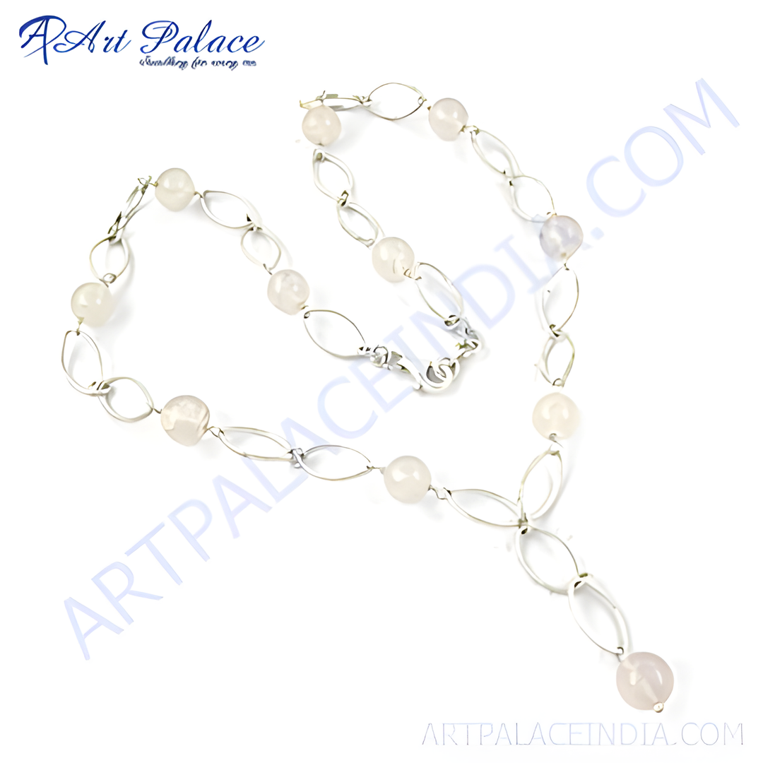 Sterling silver necklace with oval links and round rose quartz beads, a light pink gemstone, elegant design.