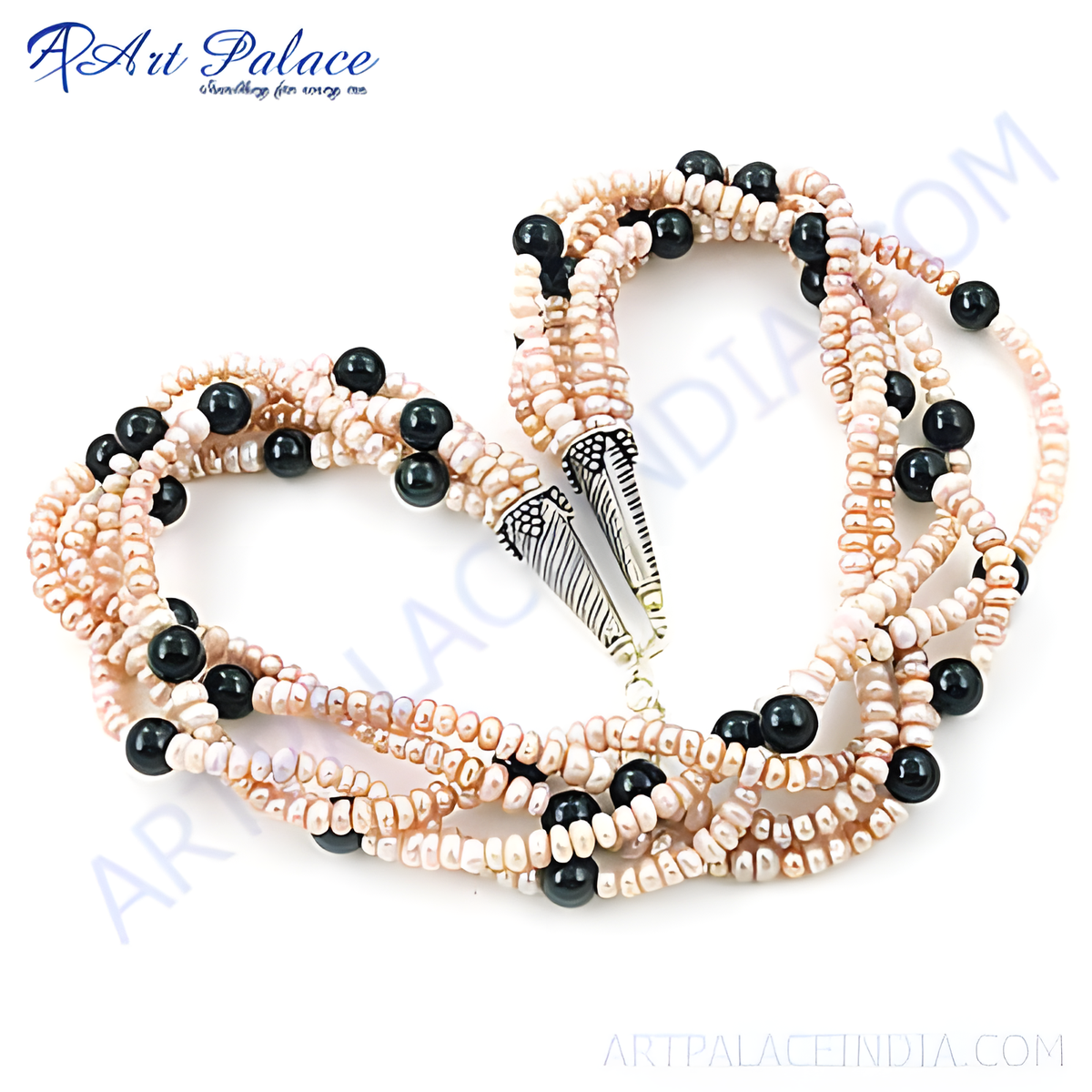 Multi strand necklace with pink pearls and black onyx beads on white background