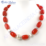 Load image into Gallery viewer, Red agate bead necklace with sterling silver accents on a white background, highlighting the gemstone and silver beads.
