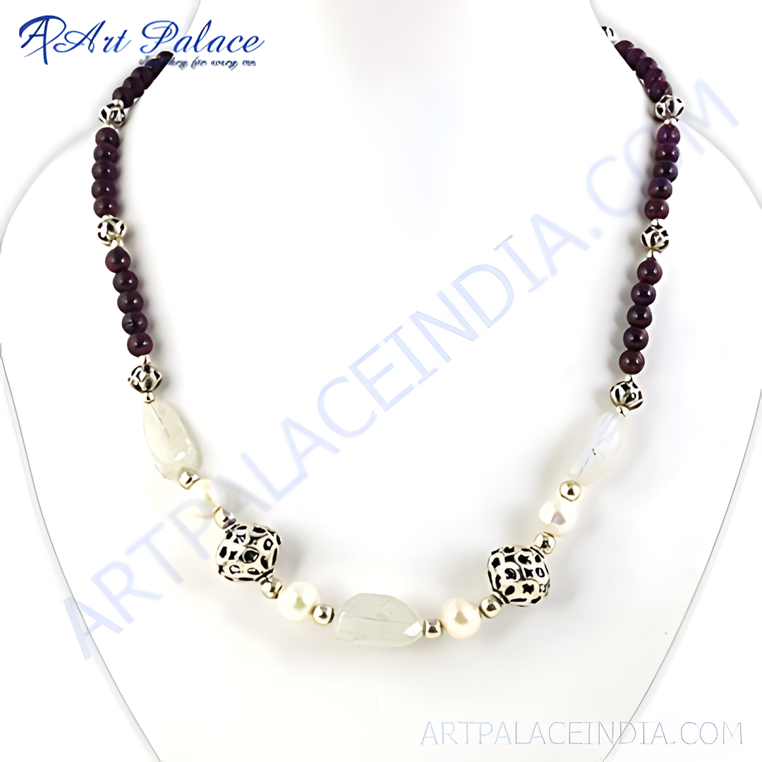 Beaded gemstone and pearl necklace on a white display. Featuring purple gemstones, pearls, and silver accents.