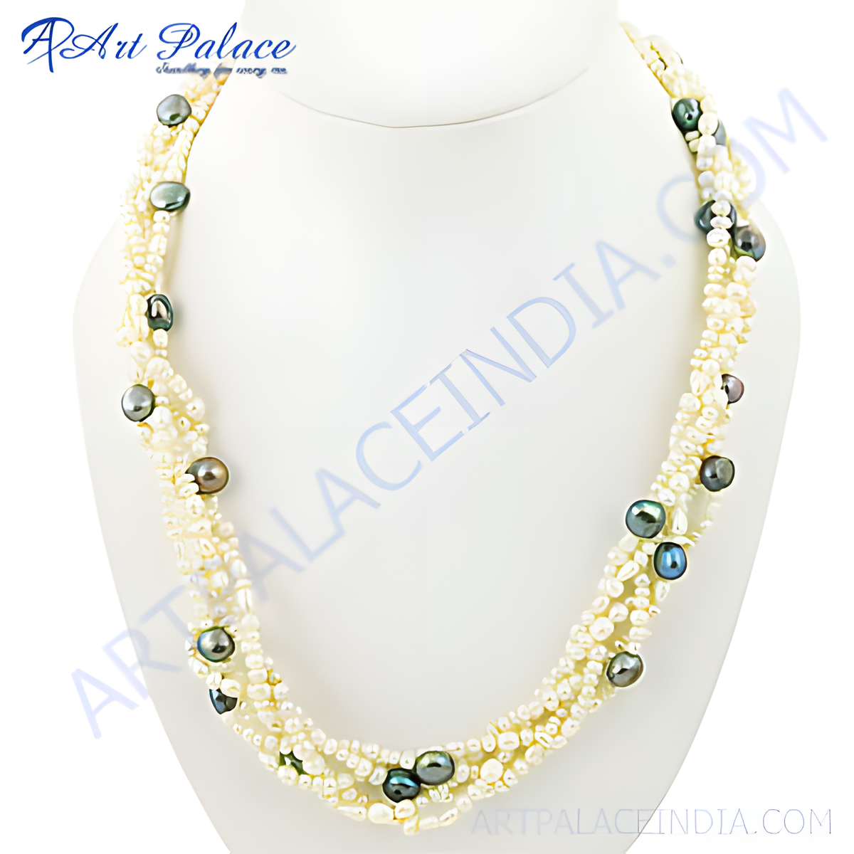 Multi strand pearl necklace with dark colored gemstones on a white mannequin