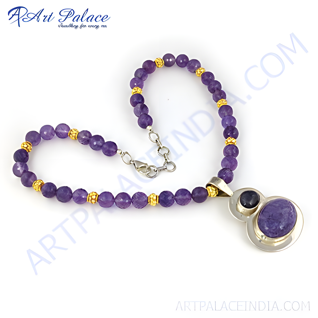 Amethyst beaded necklace with a silver pendant and purple gemstone. A beautiful necklace with gold plating accents.