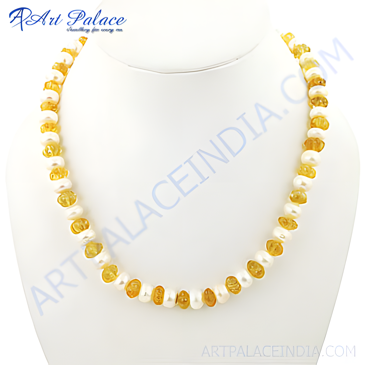Yellow amber and pearl beaded necklace displayed on a white bust, showcasing the natural gemstones