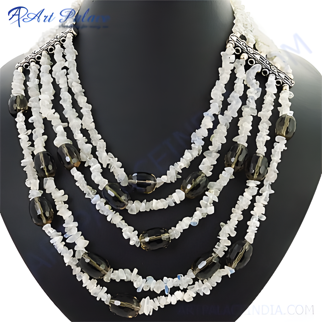 Multi-strand necklace featuring white gemstone chips and smoky quartz beads on a black mannequin
