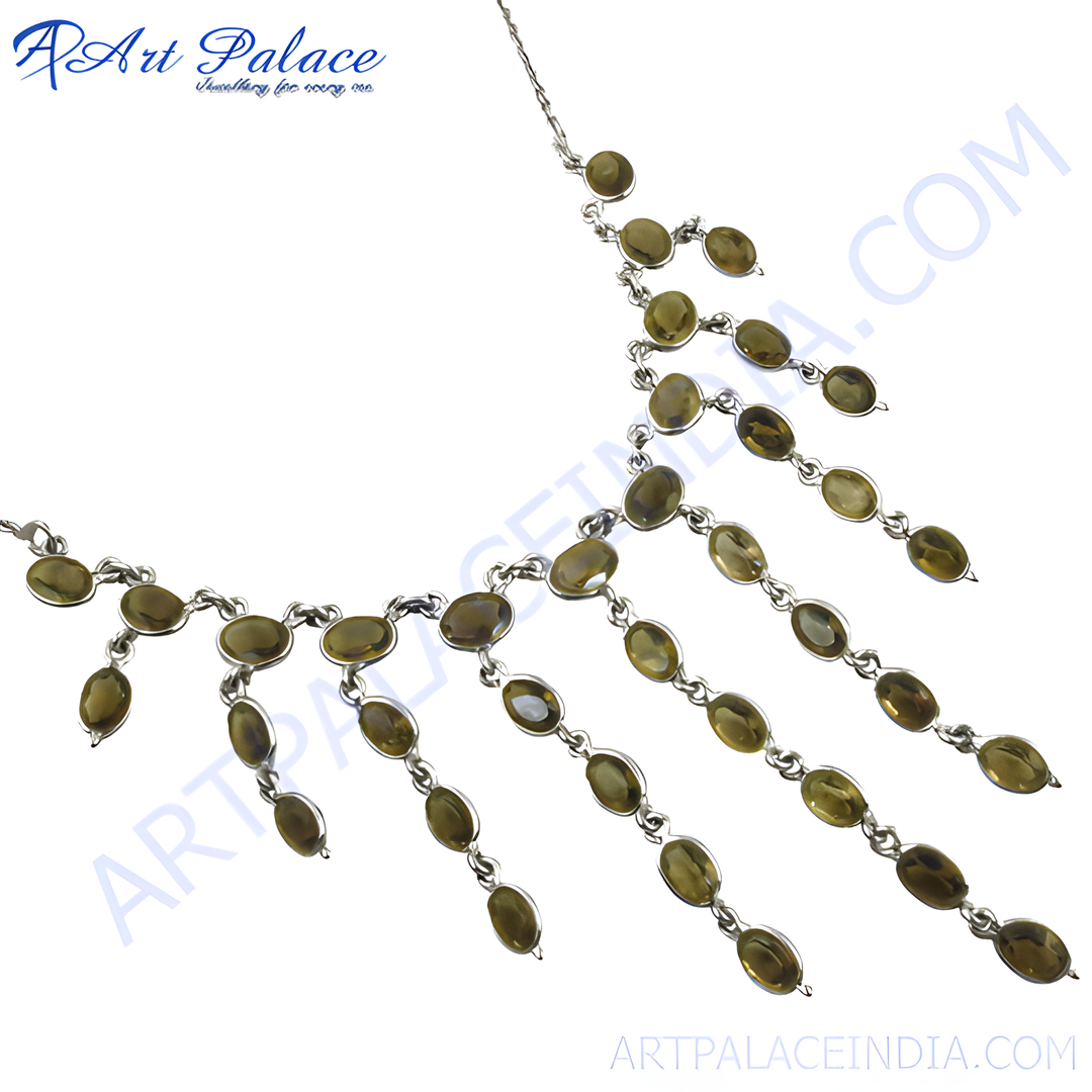 Sterling silver statement necklace with olive green gemstones on a white background.