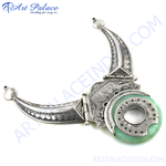 Load image into Gallery viewer, Silver pendant necklace with green stone, featuring a unique tribal design and intricate details.
