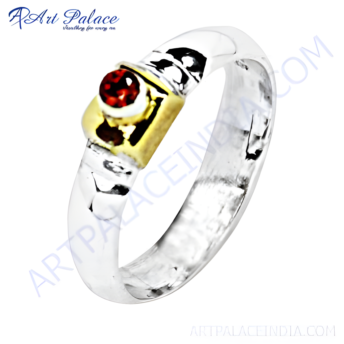 Sterling silver ring featuring a round red garnet gemstone with gold plating accents, a stunning piece of jewelry