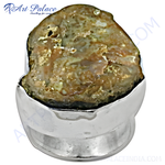 Load image into Gallery viewer, Sterling silver ring with a unique, textured stone set in a silver band. The stone has earthy tones.
