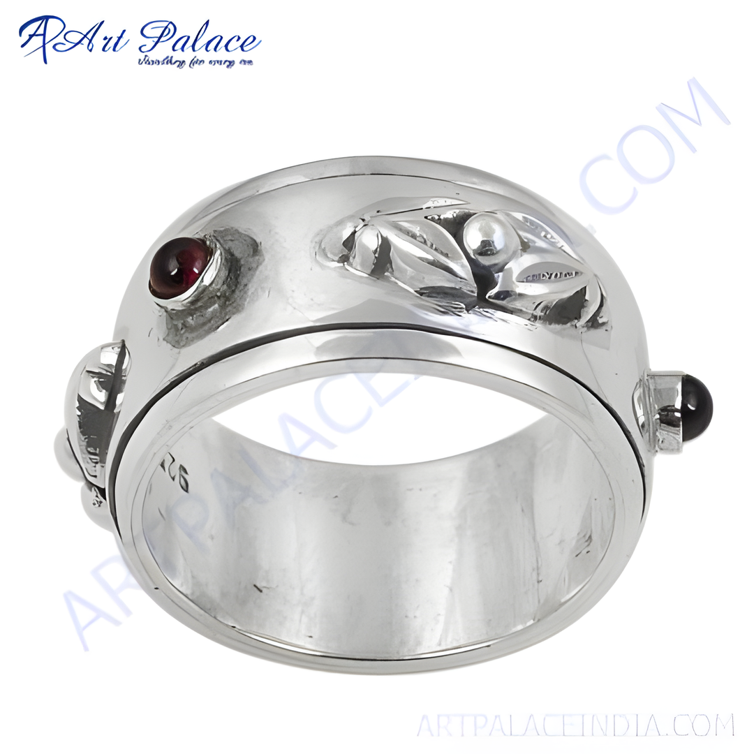 925 sterling silver spinner ring with garnet gemstones. Elegant and unique design.