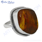 Load image into Gallery viewer, Sterling silver ring with a large amber gemstone in a statement setting.
