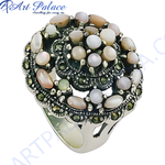 Load image into Gallery viewer, Sterling silver cocktail ring featuring mother of pearl gemstones and marcasite detailing on a white background.

