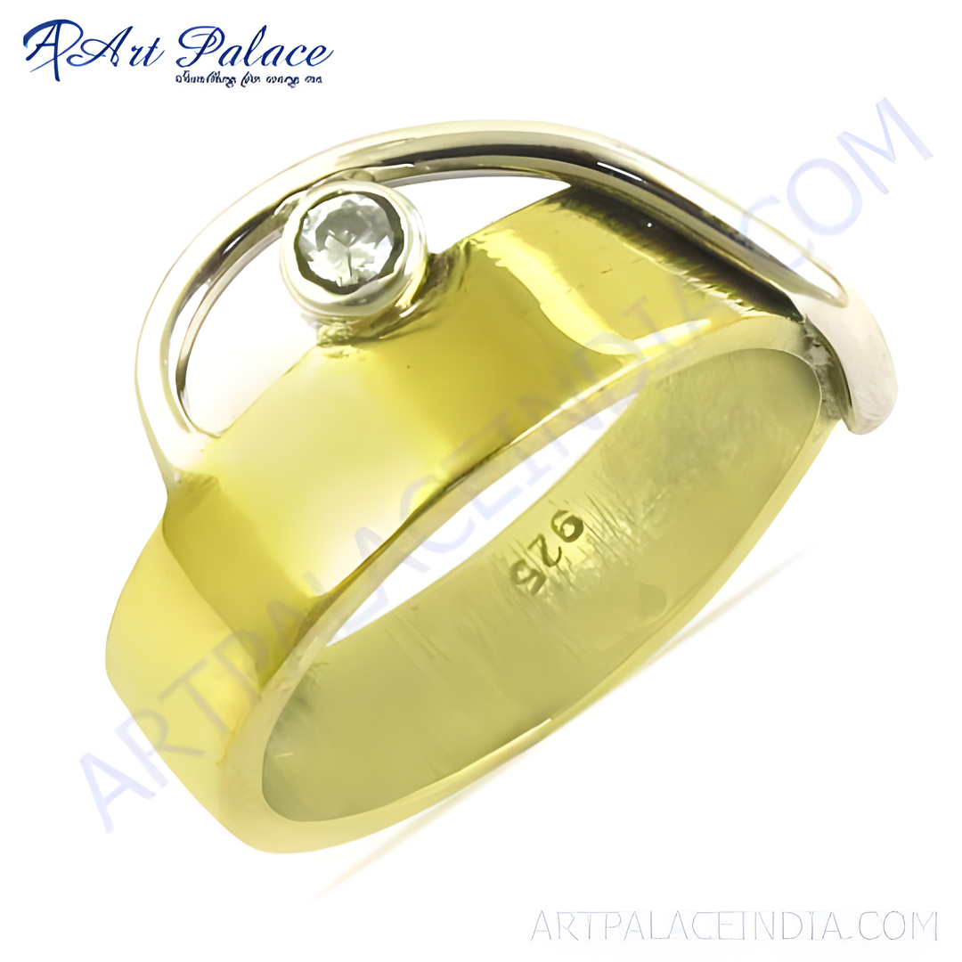 Gold plated silver ring featuring a sparkling gemstone, perfect for women's fashion jewelry.