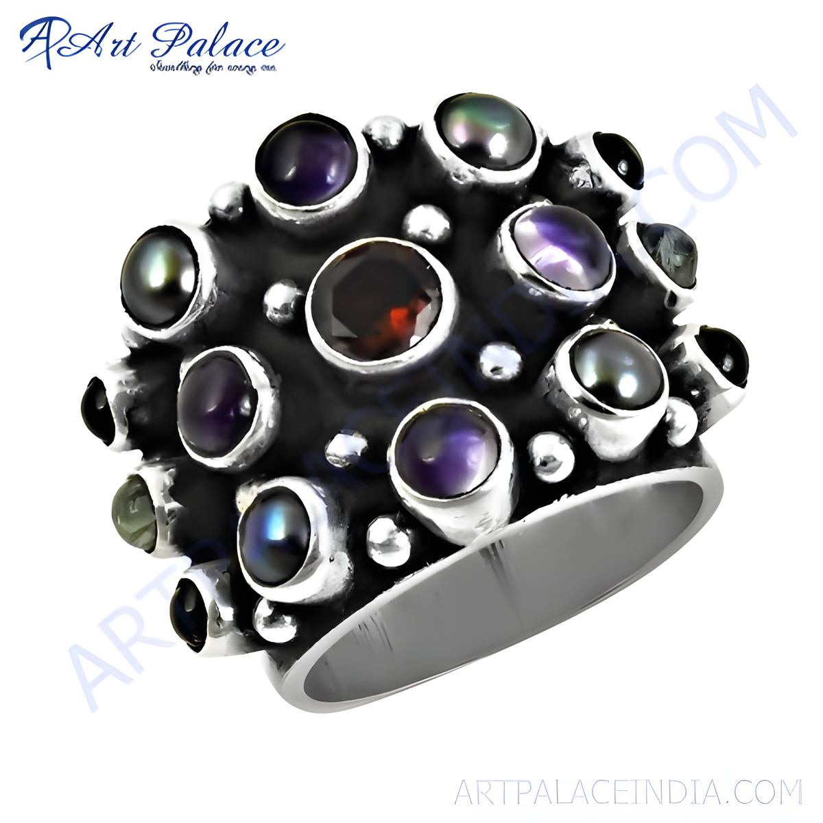 Sterling silver cocktail ring with round black and purple gemstones and a central garnet stone